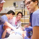 Emergency medicine environment with doctors and nurses treating a patient in the operating room