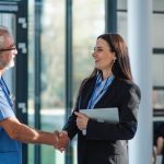 two doctors shaking hands with a candidate at a medical job interview